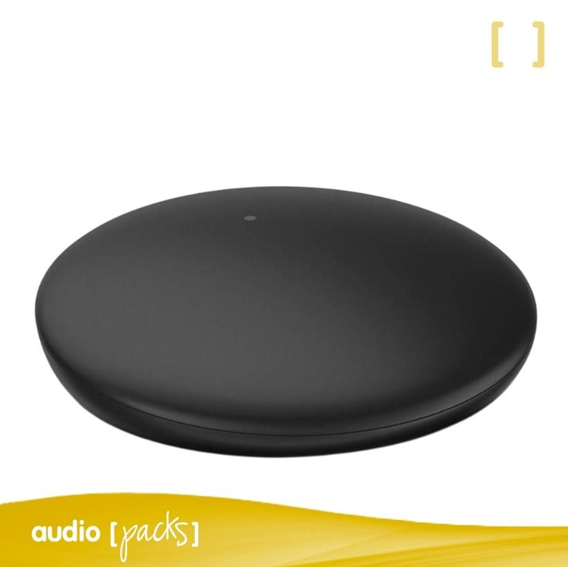 Vista frontal i superior de l'accessori de streaming Signia TV Sound, un dispositiu compacte i rodó de color negre.
